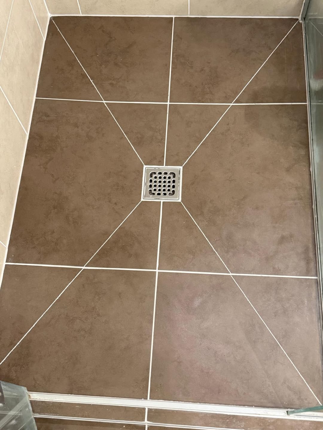 After restoration: bathroom floor grout cleaned and brightened
